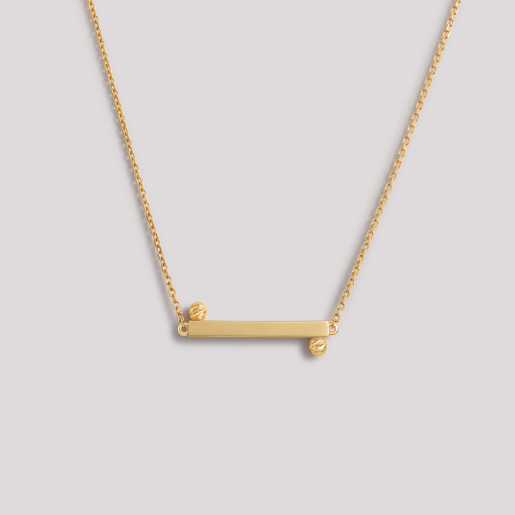 The Balance Necklace crafted in solid 18k (750) yellow gold from the Cléamoi Balance Collection.