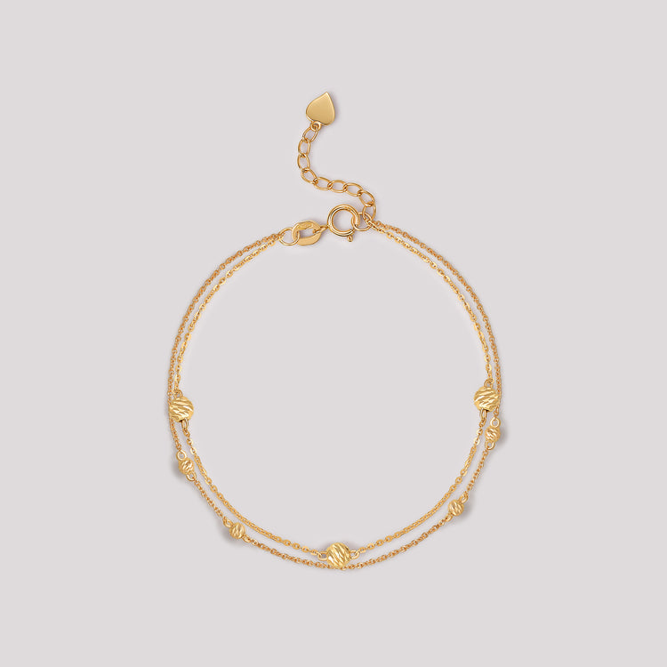 The Joy Bracelet crafted in solid 18k (750) yellow gold from the Cléamoi Joy Collection.