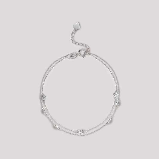 The Joy Bracelet crafted in solid 18k (750) white gold from the Cléamoi Joy Collection.
