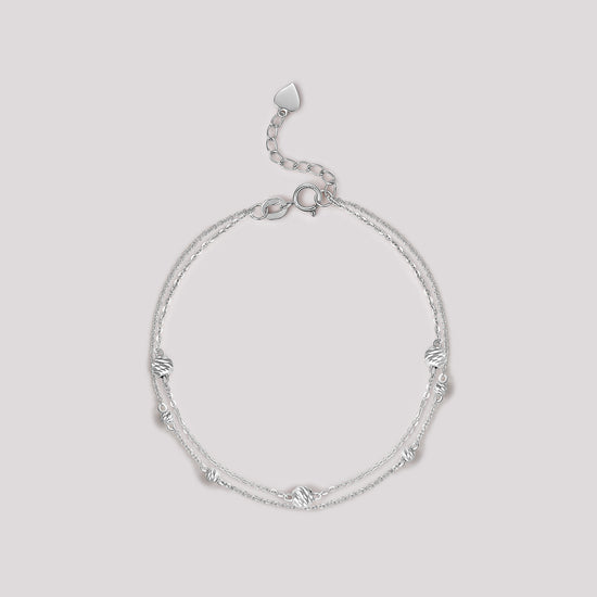 The Joy Bracelet crafted in solid 18k (750) white gold from the Cléamoi Joy Collection.