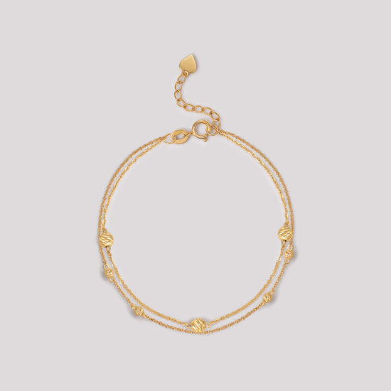The Joy Bracelet crafted in solid 18k (750) yellow gold from the Cléamoi Joy Collection.